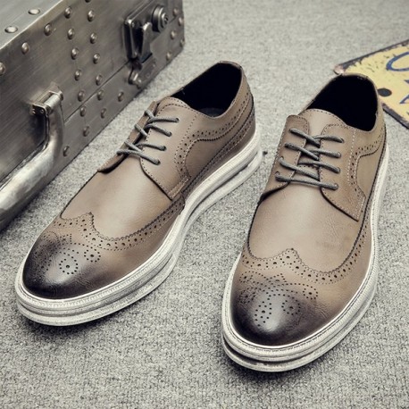 grey and white wingtip shoes